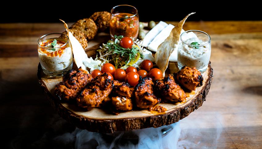 Mezze Platter - Pita bread, Lavash, Hummus, Sprout salad, Baba Ganoush and Falafel; can add tandoori chicken to this