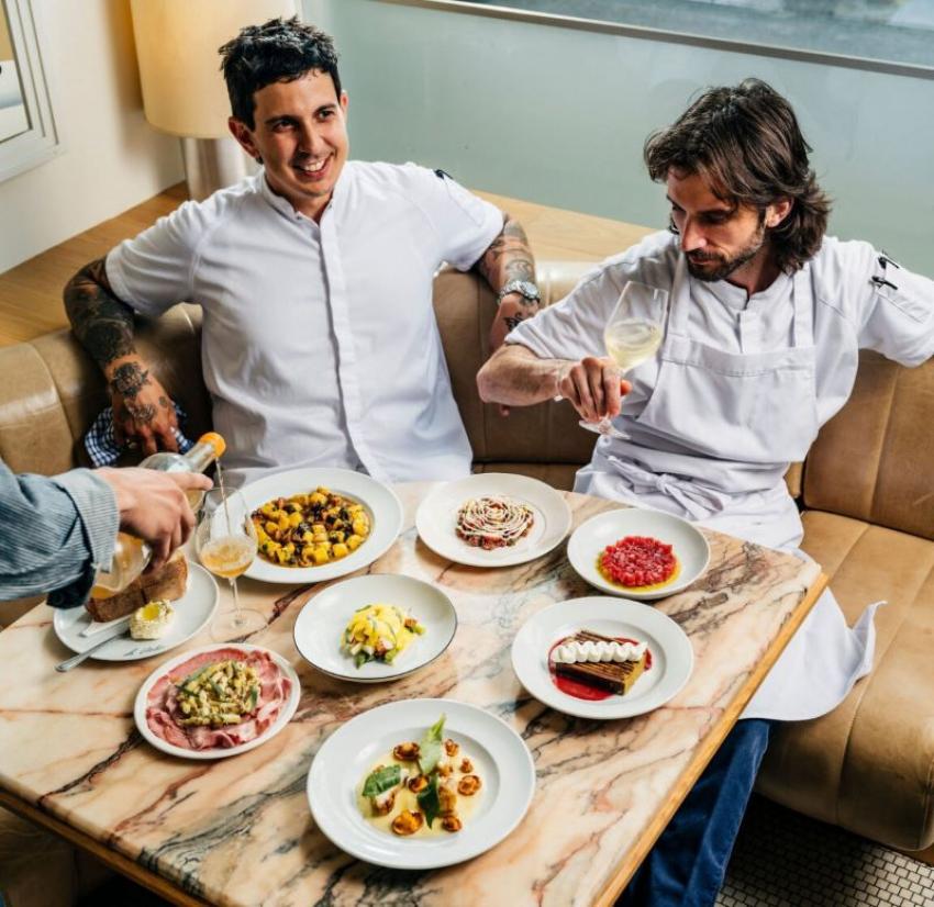 Chefs Mitch Laughren and Danny Smiles with a spread of seasonal dishes at Le Violon. Photo: Johnny C.Y. Lam/Air Canada