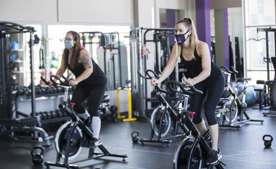 Images of the Day:People wearing face masks exercise at a reopened fitness club in Barrie