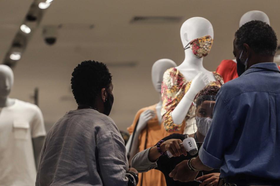 Images of the Day:Consumers get their temperature checked at a store entrance in Brazil's San Paulo