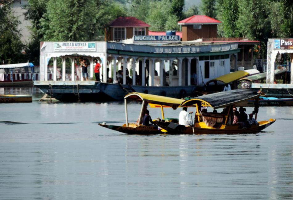 Tourists taking a shikara ride in Srinagar's Dal L ...