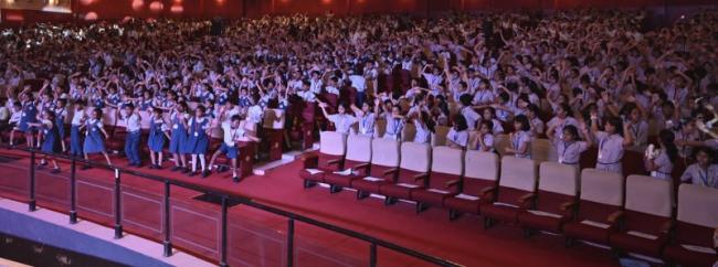 Students break into laughter at the show