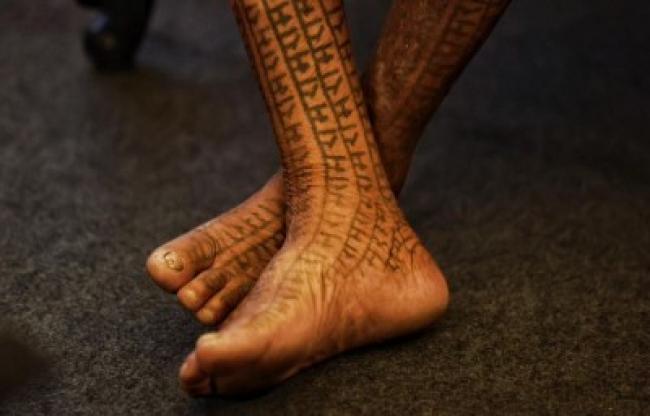 The word ‘Ram’ tattooed across the feet of a Ramnami Samaj member, reflecting a century-old tradition of faith and resistance. Photo: Avishek Mitra/IBNS